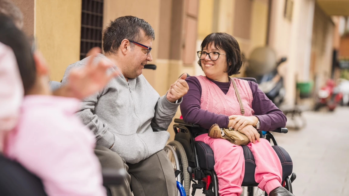 Two disabled friends talking