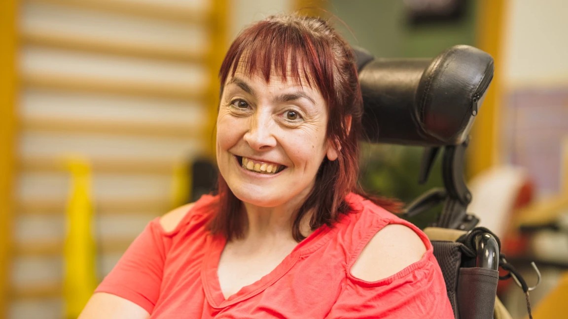 Disabled woman smiling at camera